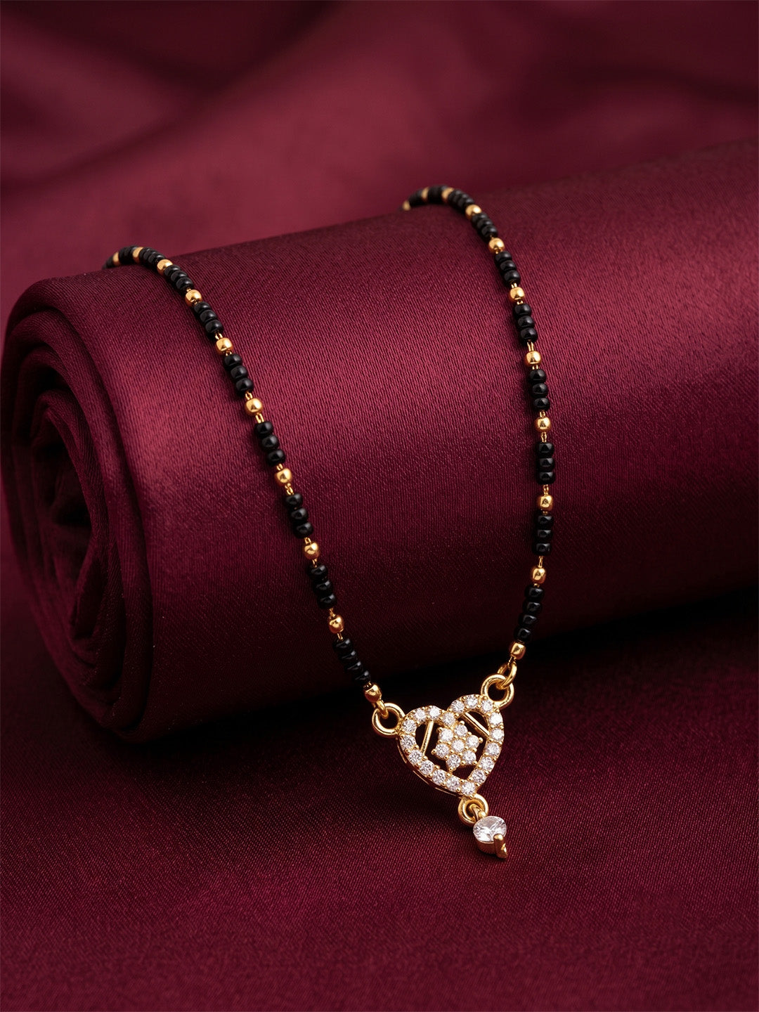 lfariya jewellery elegant Indian bridal mangalsutra necklace crafted with a premium gold plated finish, square ruby centerpiece, traditional black bead chain and timeless ethnic styling for women.