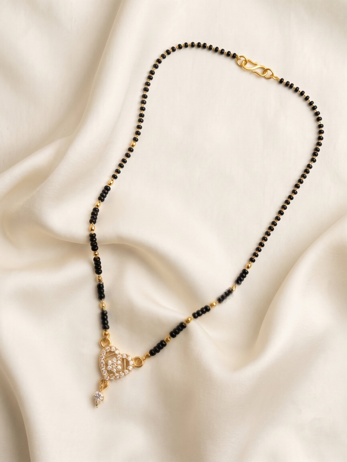 lfariya jewellery royal gold plated mangalsutra featuring a luxurious square red gemstone pendant, handcrafted black bead chain and graceful Indian jewelry design for weddings, festivals and daily elegance.