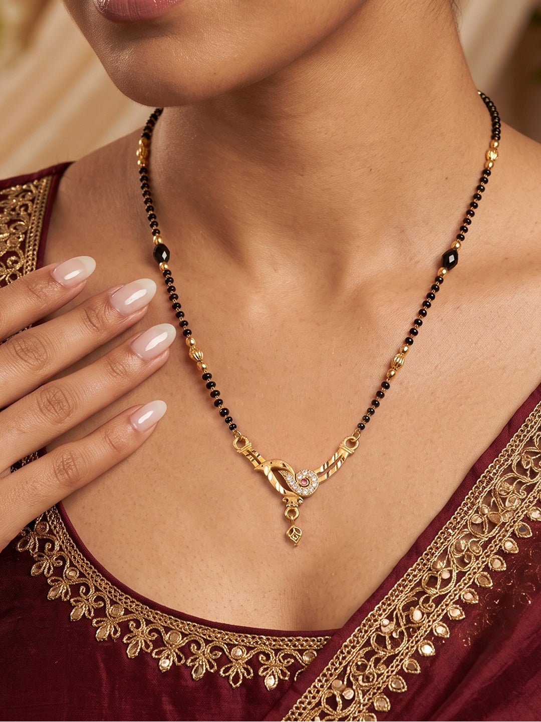Lfariya Jewellery Golden Sparrow CZ Gold Plated Mangalsutra with bird-inspired pendant, black beads and sparkling cubic zirconia for women.