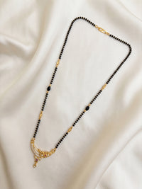 lfariya jewellery gold plated mangalsutra necklace featuring a square ruby red gemstone pendant with sparkling crystal halo, elegant black bead chain, premium craftsmanship for women, perfect for daily and festive wear.