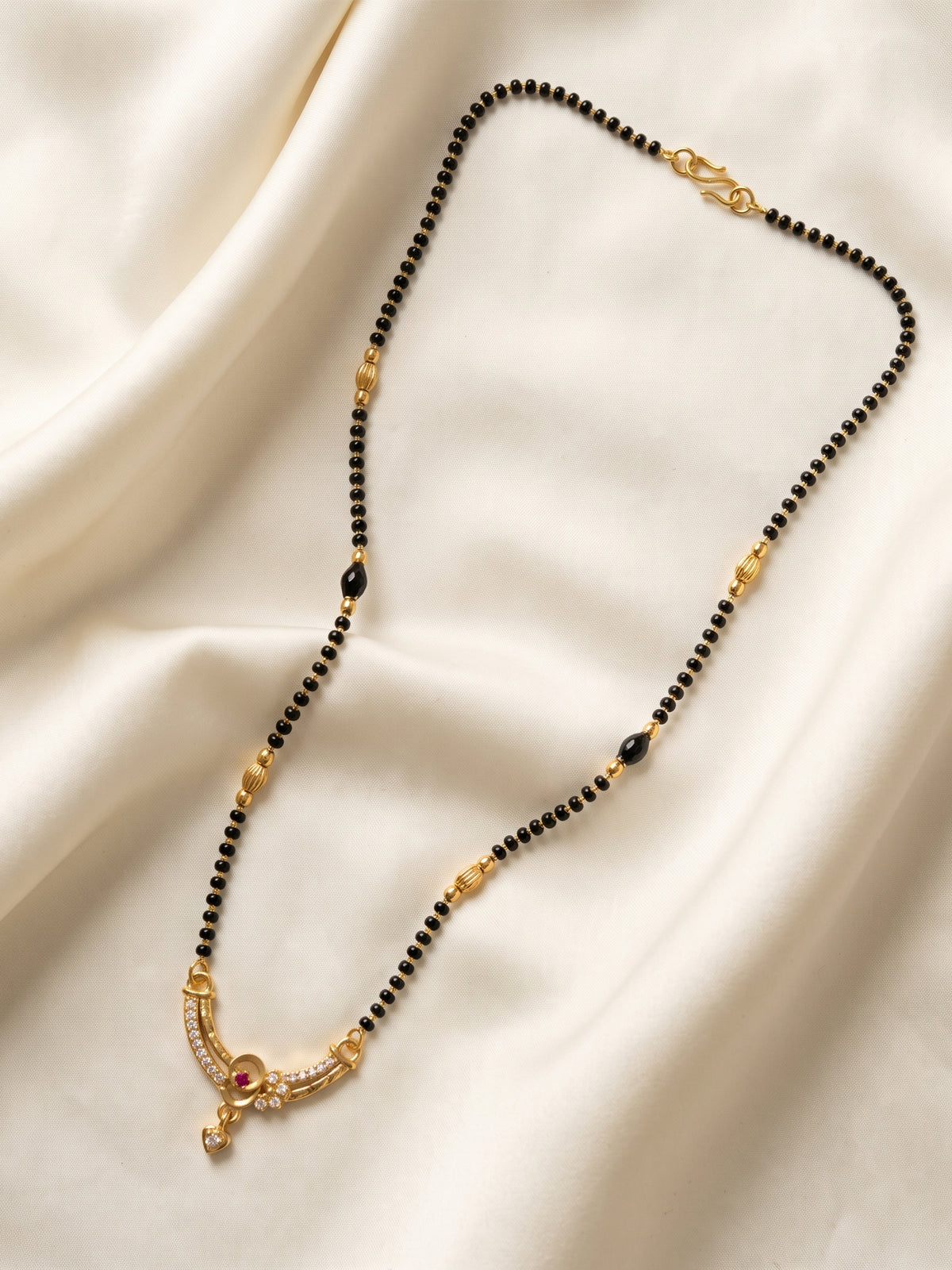 lfariya jewellery fashionable mangalsutra necklace designed with a geometric square pendant, radiant red crystal centerpiece and elegant black bead chain for modern and traditional outfits