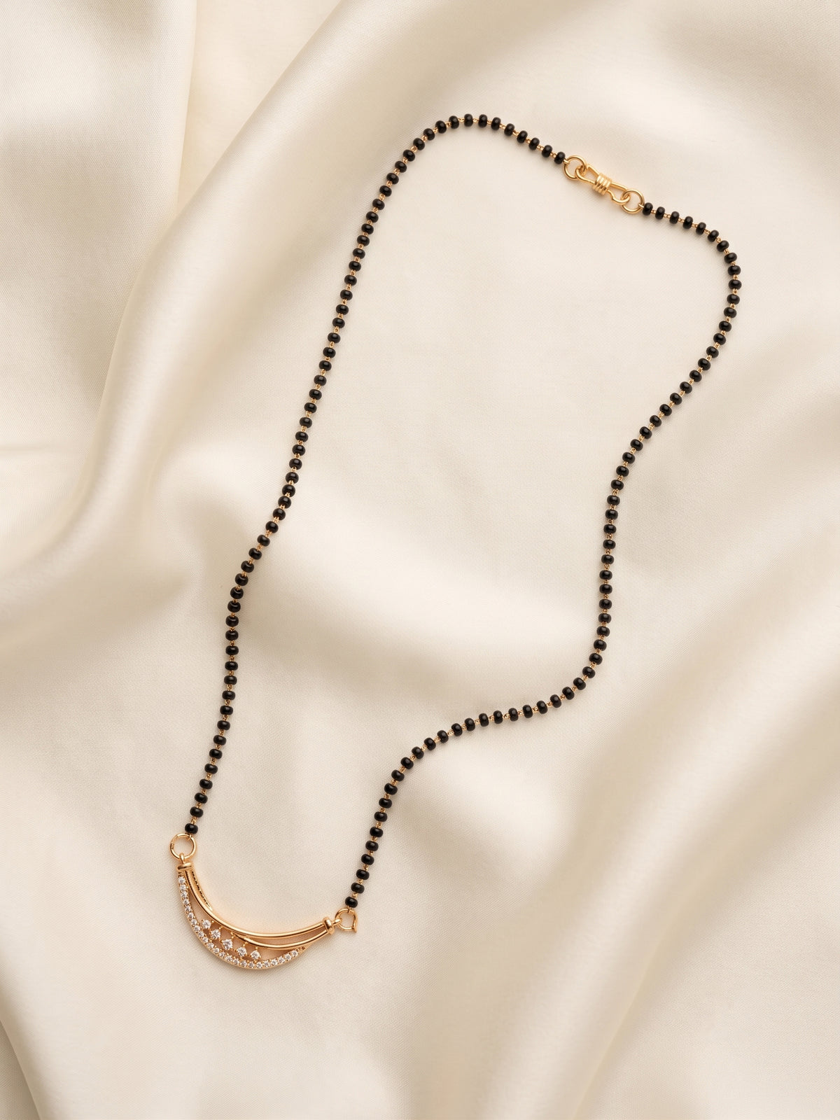 lfariya jewellery modern gold plated mangalsutra necklace showcasing a square red gemstone pendant surrounded by brilliant crystal stones on a traditional black bead chain.