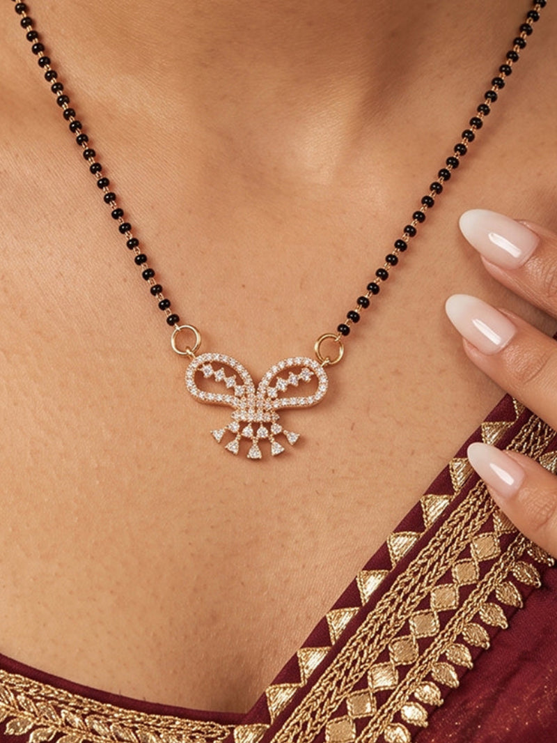 Gold plated bow shape CZ mangalsutra necklace with black bead chain for women.
