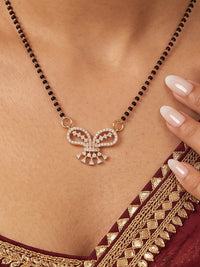 Gold plated bow shape CZ mangalsutra necklace with black bead chain for women.