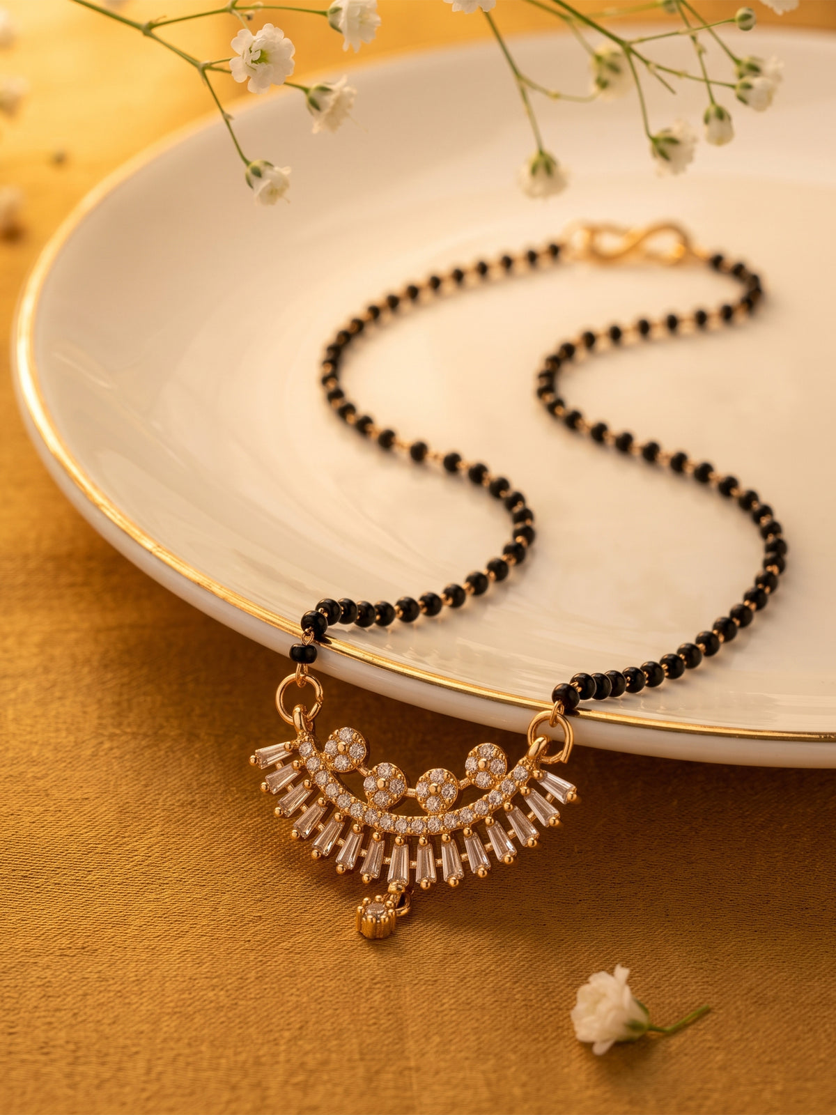 lfariya jewellery festive collection gold plated mangalsutra with a sparkling square gemstone pendant, premium black bead chain and timeless traditional craftsmanship for women.