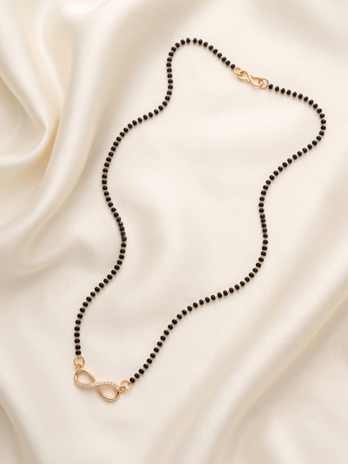 lfariya jewellery graceful black bead mangalsutra with a luxurious square pendant, vibrant gemstone center and polished gold plated craftsmanship
