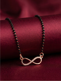 lfariya jewellery women's gold plated mangalsutra with a sparkling geometric pendant, brilliant ruby centerpiece and sophisticated black bead design
