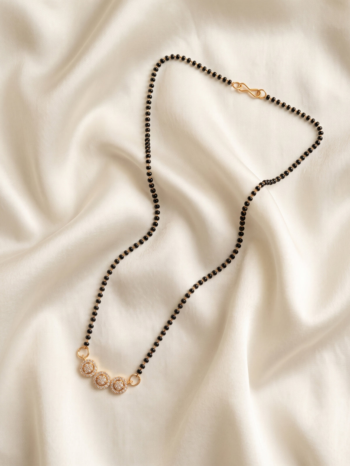 lfariya jewellery premium ethnic mangalsutra necklace with gold plated finish, square gemstone pendant and elegant black bead chain, designed for weddings and special occasions.