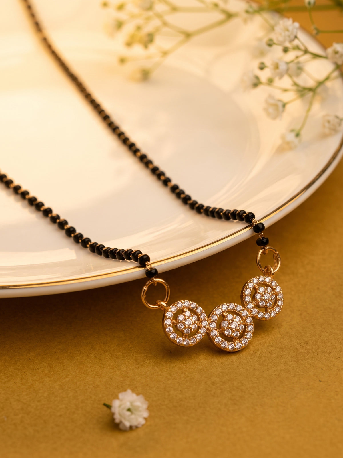 lfariya jewellery fashionable black bead mangalsutra with a luxurious ruby pendant, polished gold plated finish and sparkling stone accents for women who love traditional jewelry