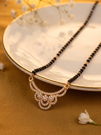 lfariya jewellery exclusive designer mangalsutra necklace with a bold ruby gemstone pendant, polished gold finish and graceful black bead chain for everyday and festive wear.