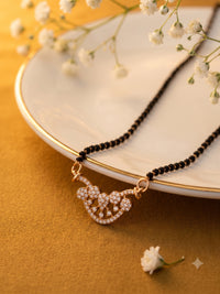 lfariya jewellery bridal collection gold plated mangalsutra with luxurious ruby pendant, sparkling crystal accents and classic black bead chain for weddings and celebrations.