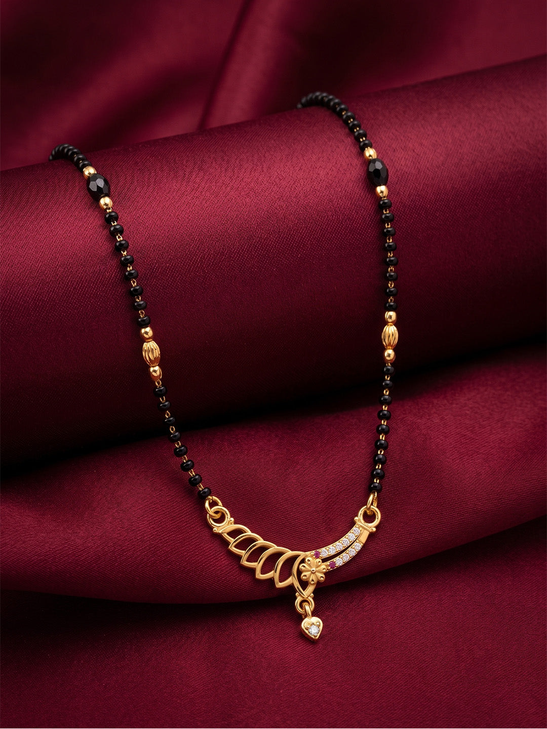 lfariya jewellery handcrafted gold plated mangalsutra featuring a classic square gemstone pendant, elegant black bead chain and refined jewelry craftsmanship, photographed in a premium luxury product display