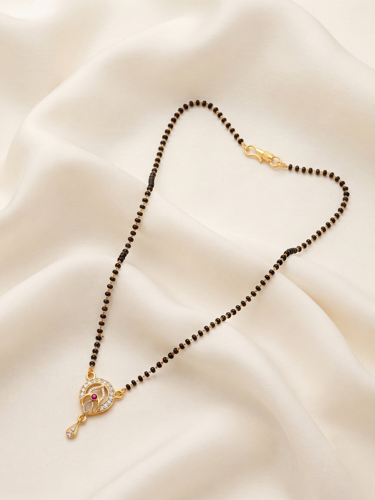 lfariya jewellery premium festive jewelry with a stylish square pendant, brilliant ruby stone, polished gold plated finish and traditional black bead chain perfect for gifting and celebrations.