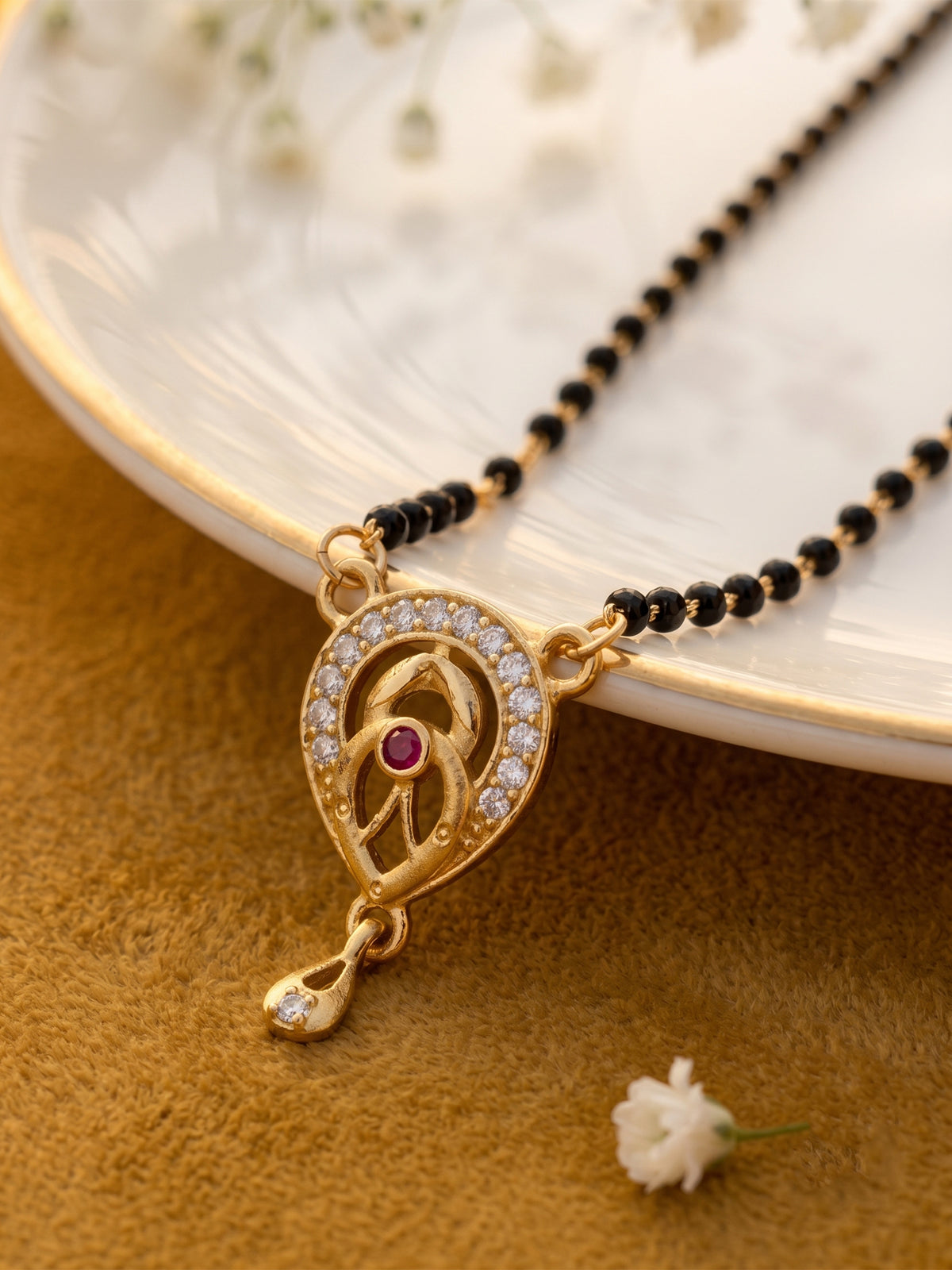 lfariya jewellery signature gold plated mangalsutra designed with an elegant square gemstone pendant, refined sparkle, black bead chain and luxury presentation for women seeking timeless style.