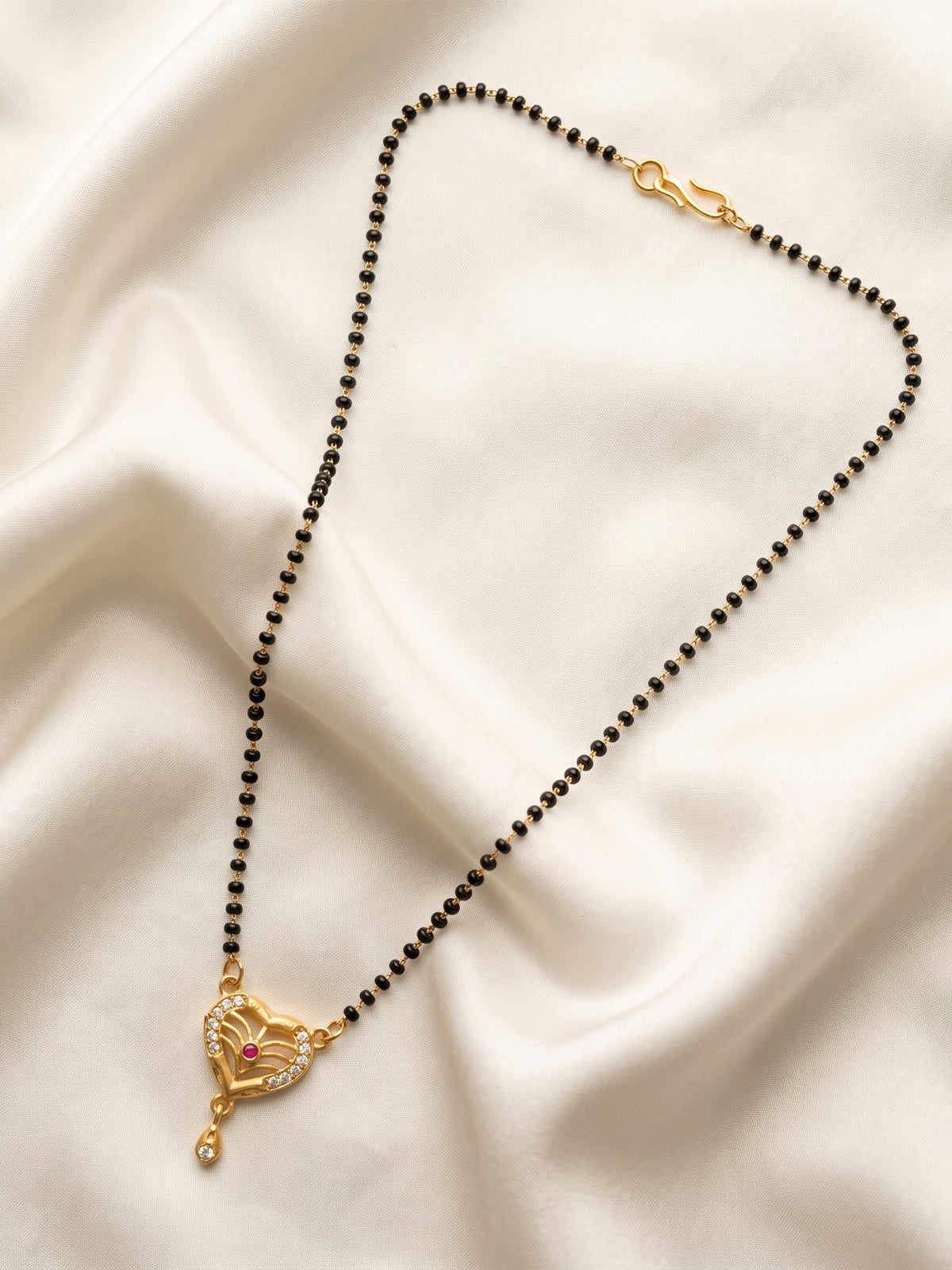 lfariya jewellery bridal style gold plated mangalsutra necklace with a square ruby pendant and traditional black beads, ideal for weddings, Karwa Chauth and festivals.