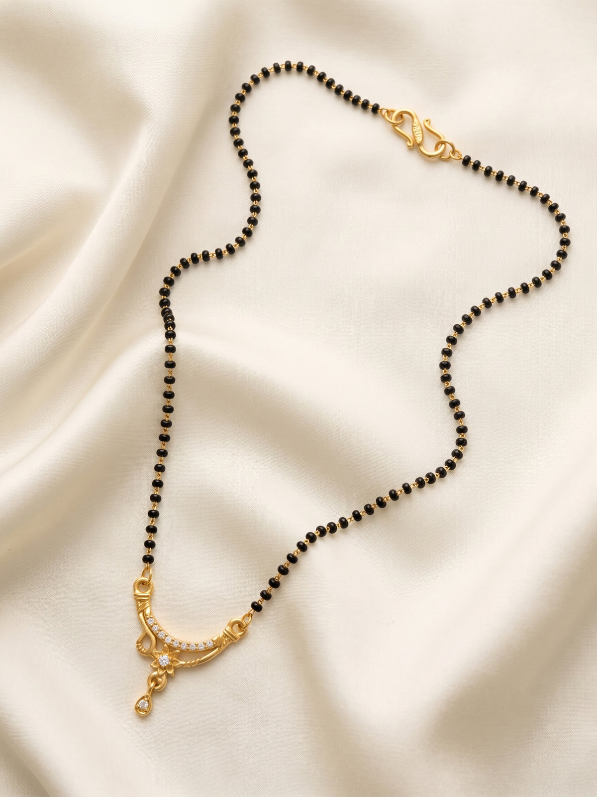 lfariya jewellery premium ethnic mangalsutra featuring a royal square red gemstone pendant, gold plated finish and handcrafted black bead chain for Indian women.