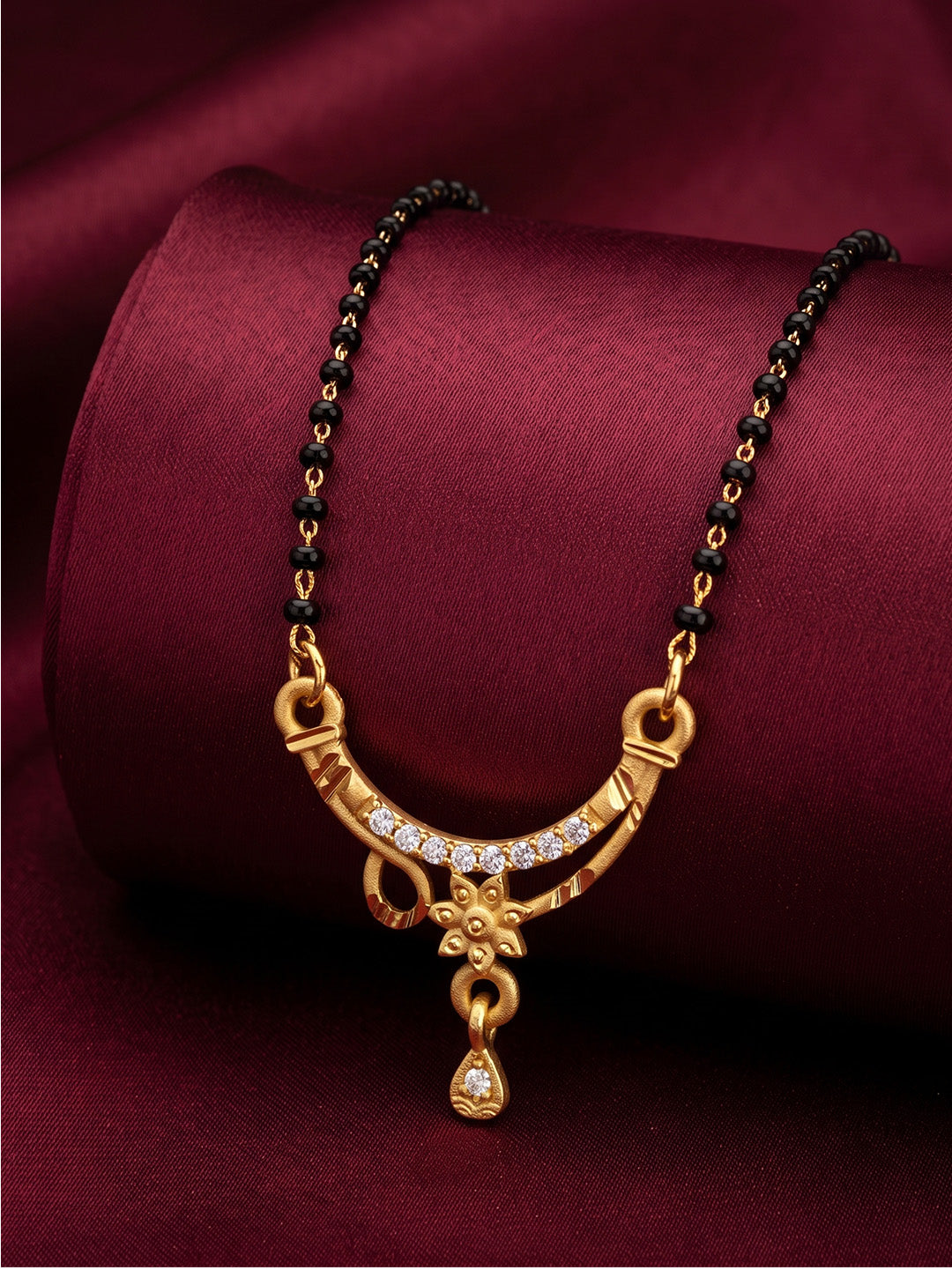 lfariya jewellery traditional Indian gold plated mangalsutra necklace with an elegant square ruby pendant and classic black bead chain, beautifully styled for bridal and festive wear.