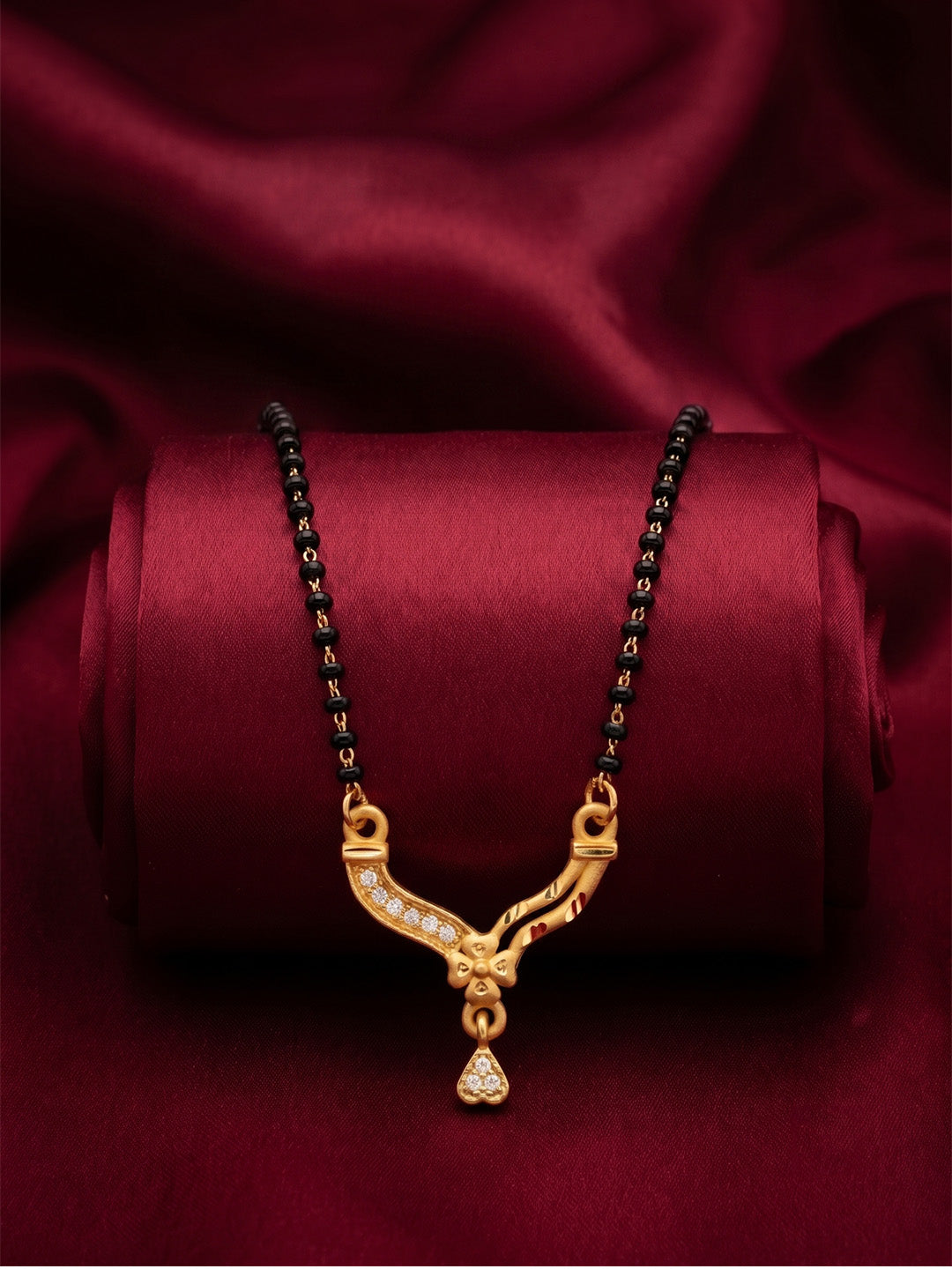 lfariya jewellery handcrafted Indian mangalsutra with a luxury square red stone pendant, premium gold plated shine and beautifully crafted black bead necklace.