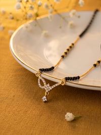 lfariya jewellery elegant bridal mangalsutra necklace with a square gemstone pendant, polished gold plated finish and traditional black bead chain for every occasion.