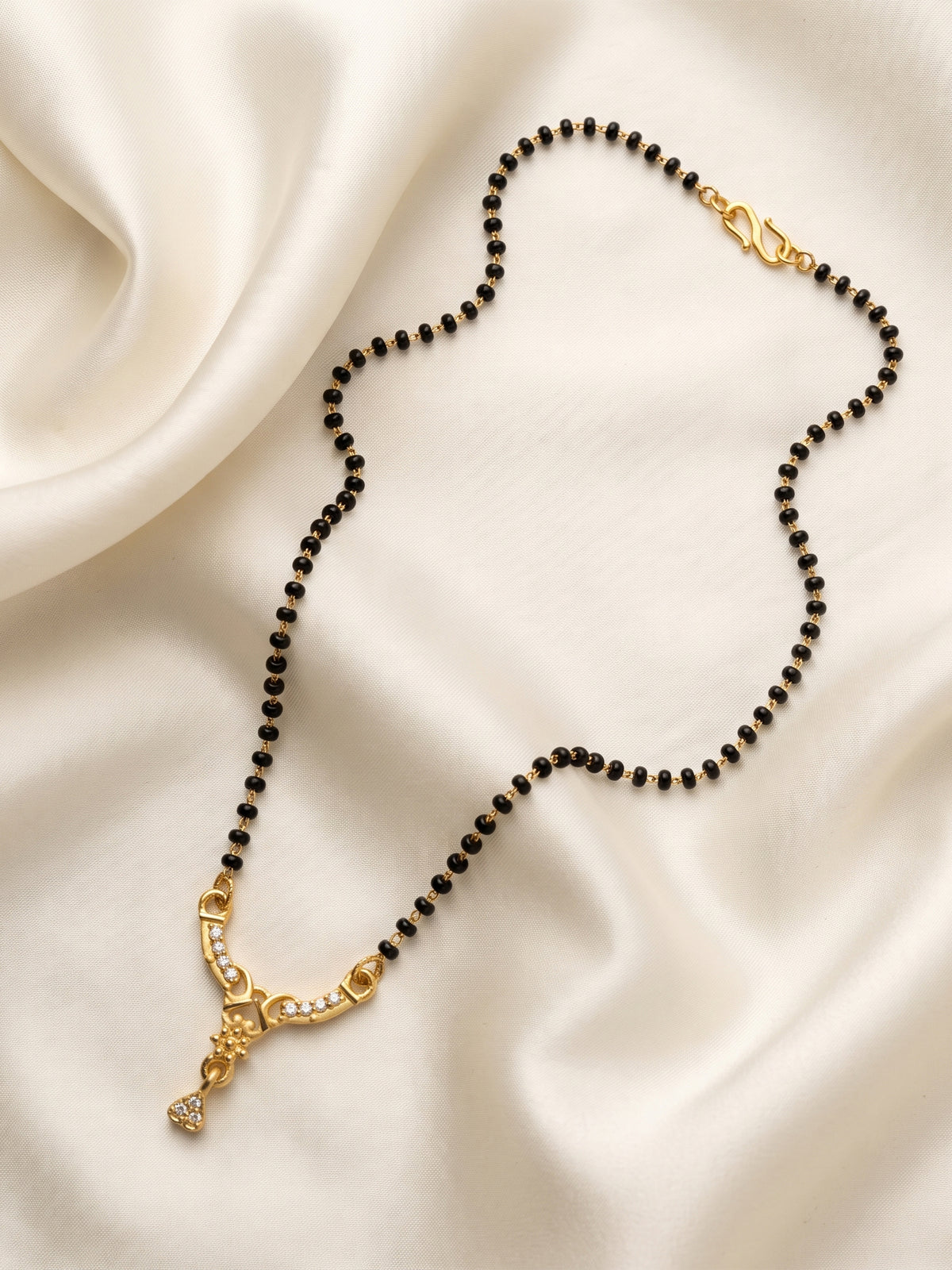 lfariya jewellery premium women's mangalsutra with a luxurious square gemstone pendant, handcrafted gold plated design and elegant black bead chain for festive celebrations.