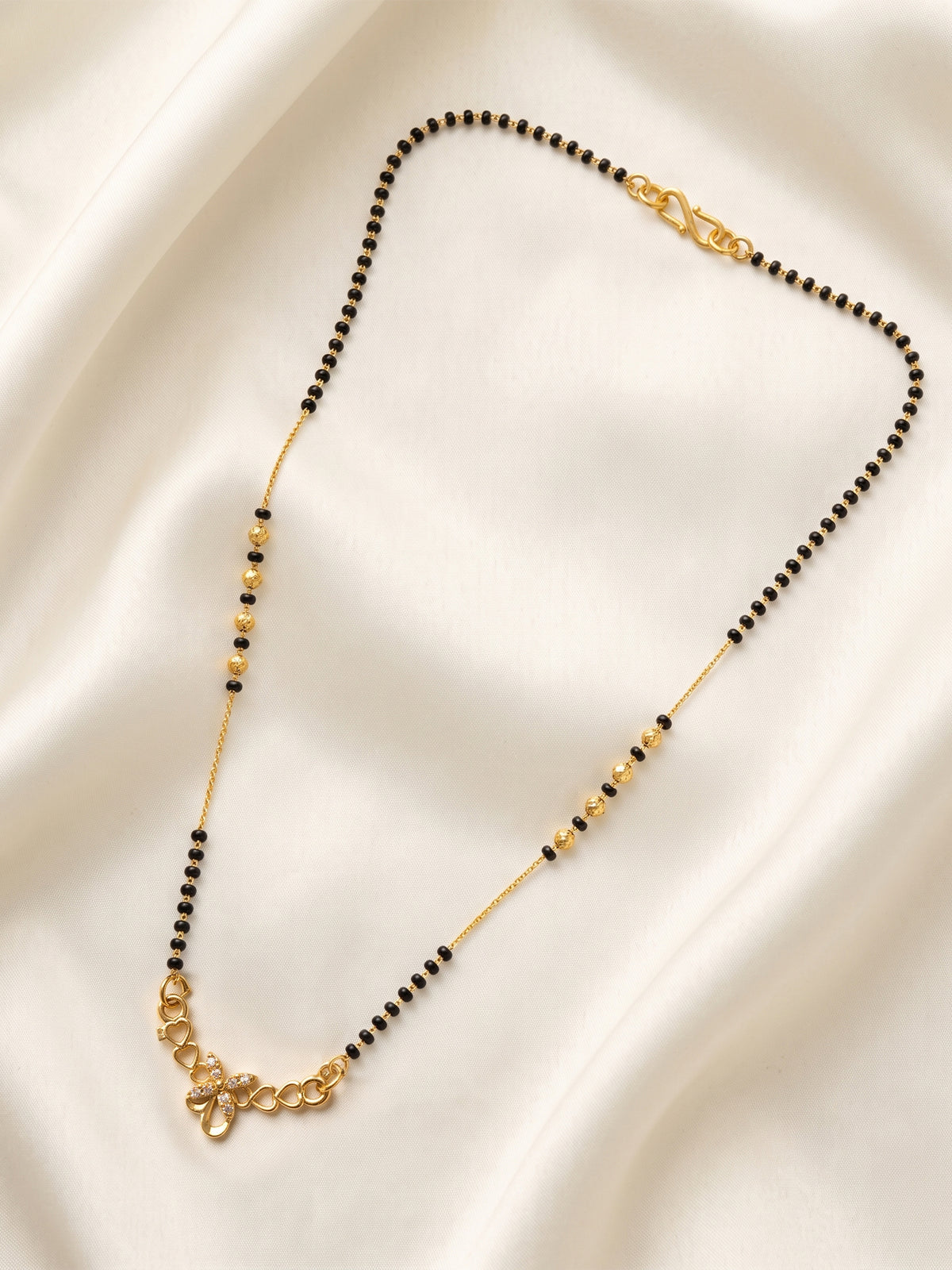 lfariya jewellery traditional black bead mangalsutra with a luxurious square pendant, radiant ruby stone and premium gold plated craftsmanship for women.