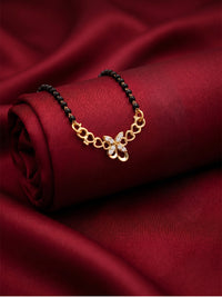 lfariya jewellery premium designer mangalsutra featuring a vibrant red gemstone pendant, polished gold plated finish and classic black bead chain for Indian ethnic fashion.