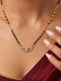 Celestial Bloom Curve Mangalsutra by Lfariya Jewellery featuring a curved CZ floral pendant with black beads and gold-tone chain for elegant daily wear.