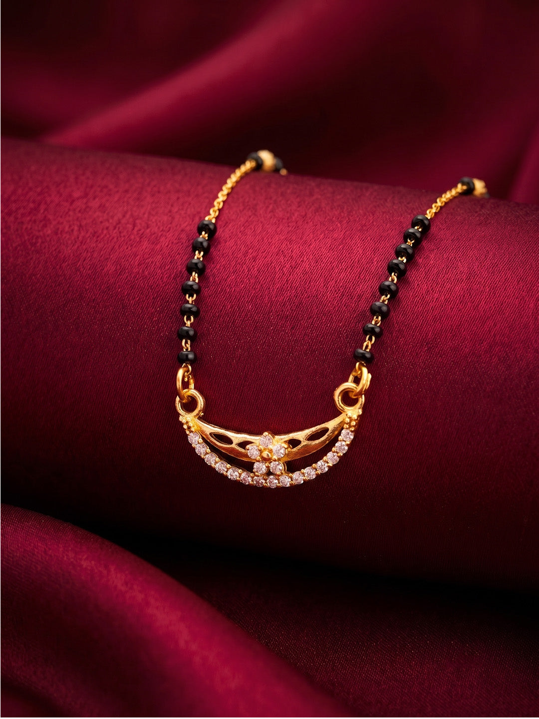 lfariya jewellery festive wear mangalsutra featuring a sparkling square red gemstone pendant, gold plated finish and traditional black bead necklace for women.