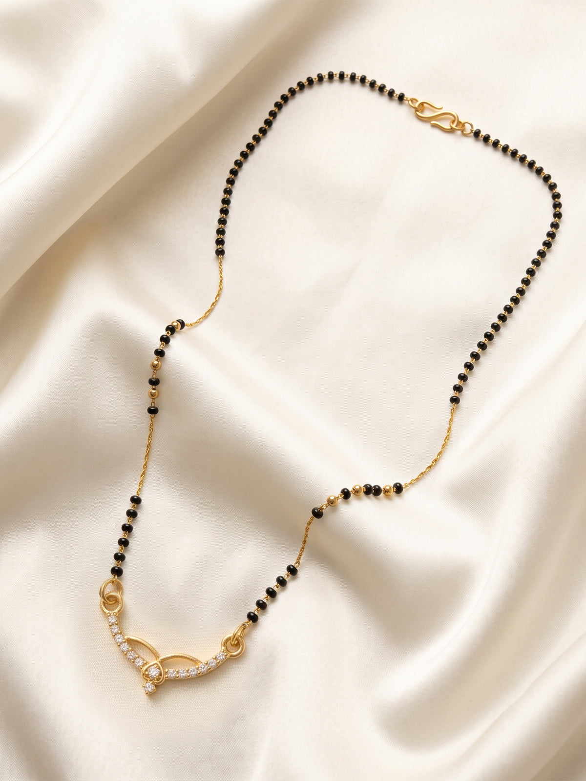 lfariya jewellery stylish women's mangalsutra necklace with a classic square pendant, brilliant red gemstone and traditional black bead chain for Indian weddings.