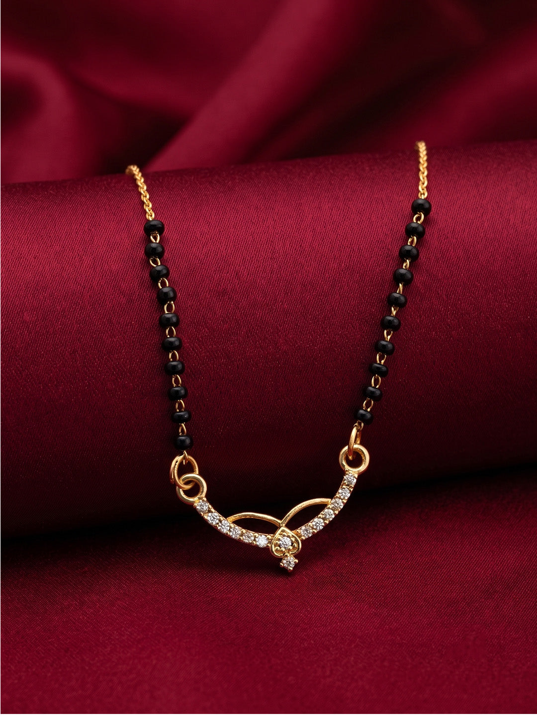 lfariya jewellery ethnic gold plated mangalsutra showcasing a premium square ruby pendant, elegant black bead chain and refined craftsmanship for festive celebrations.