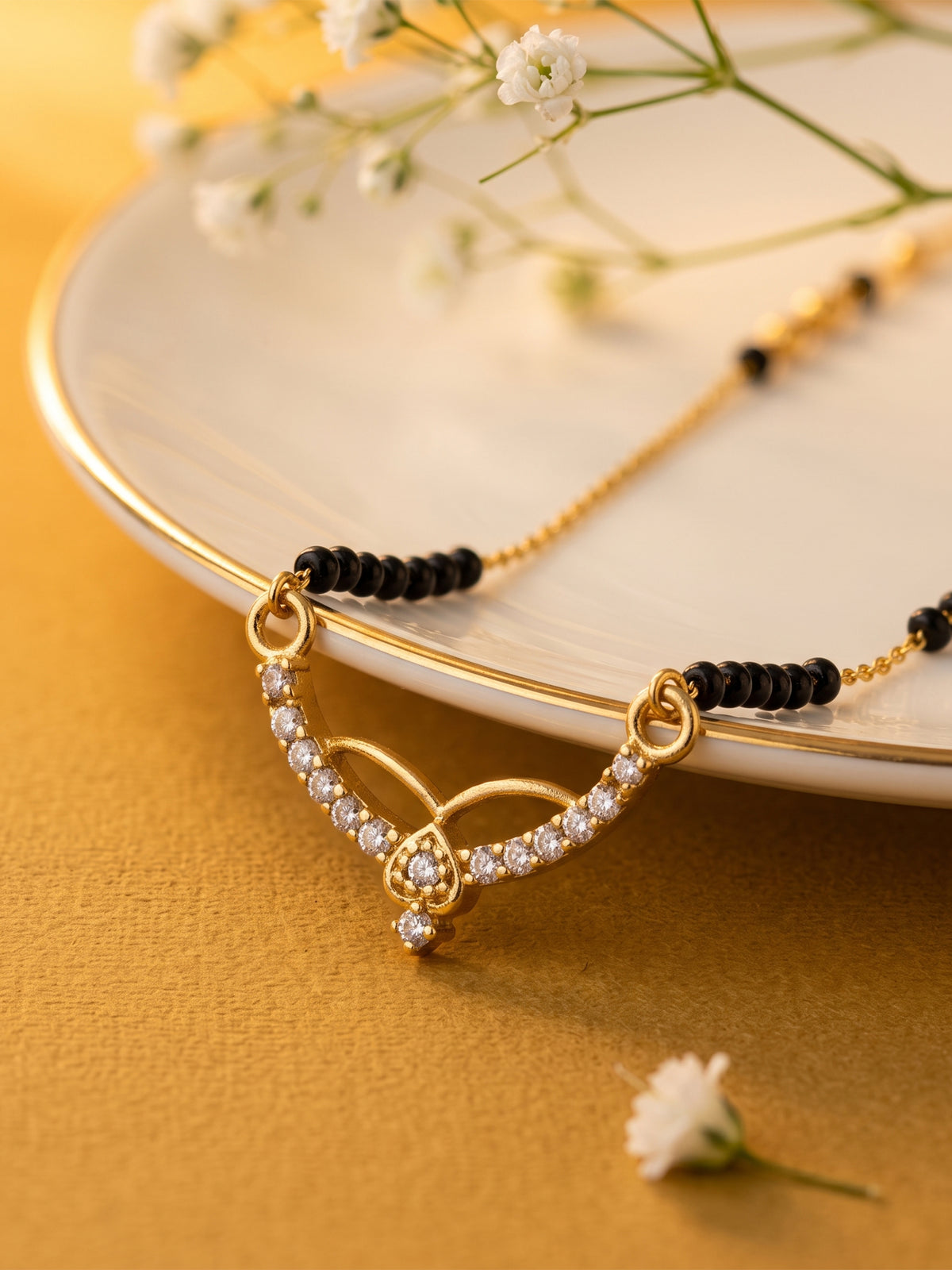 lfariya jewellery luxury gold plated mangalsutra with an eye catching square ruby pendant, handcrafted black bead chain and elegant jewelry styling for women.
