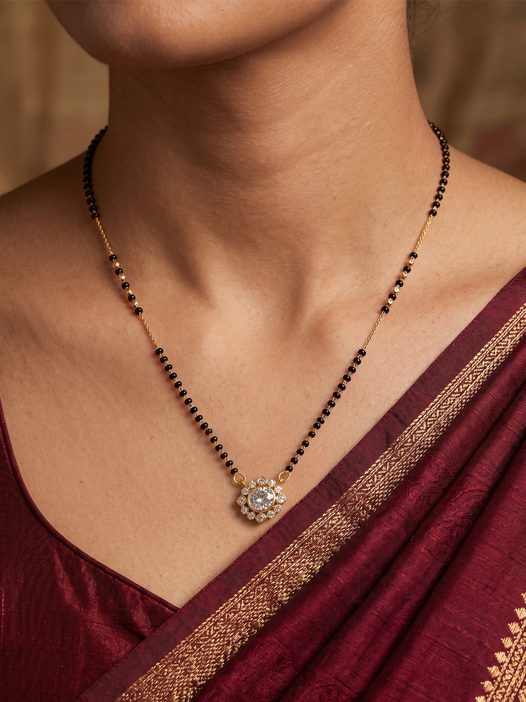 Lfariya Jewellery Sunflare Bloom CZ Gold Plated Mangalsutra with floral round pendant and black bead chain for women.