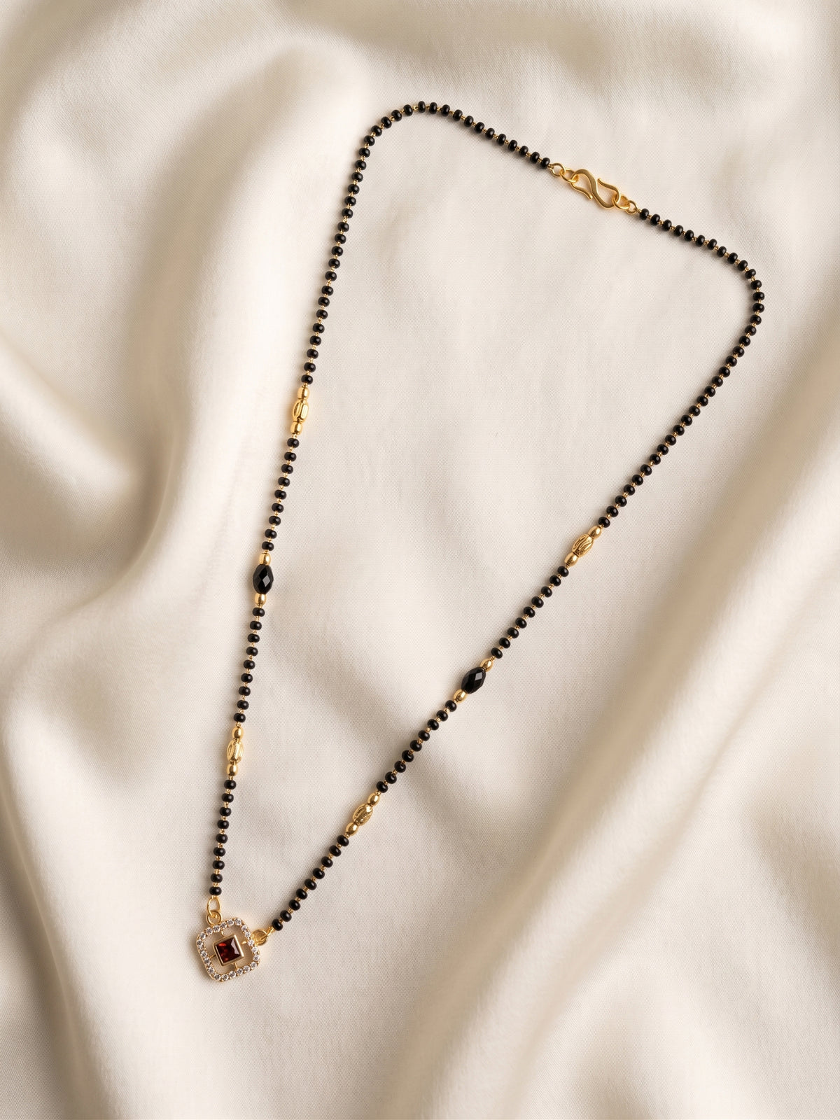 lfariya jewellery elegant ethnic mangalsutra necklace showcasing a square ruby centerpiece, luxury gold plated finish and handcrafted black bead chain for modern Indian women.